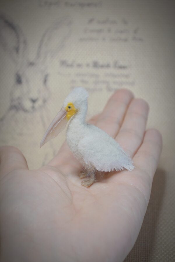 Needle felted pelican miniature with movable neck. Handmade wool bird collectible for dollhouses, dioramas, and bird lovers.