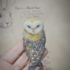 Handmade needle felted owl brooch. A unique wool accessory with secure pin, perfect for jackets, scarves, and as a gift for owl lovers.