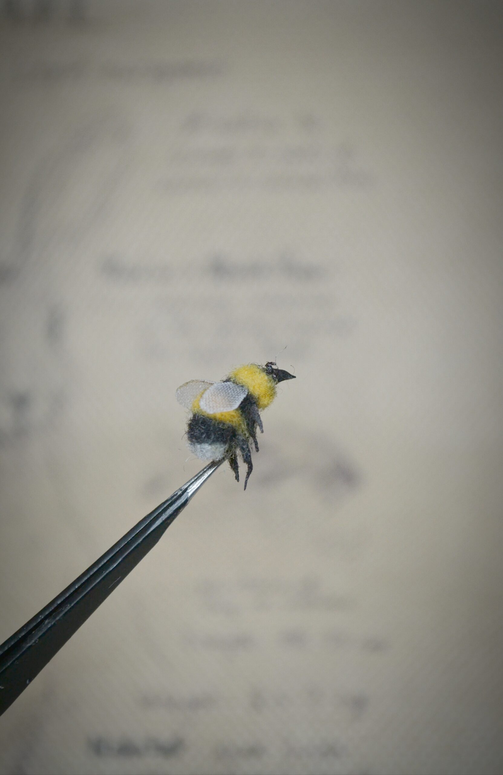 Tiny handmade needle felted bumblebee miniature. Realistic wool insect collectible perfect for dollhouses, nature lovers, and felted art fans.