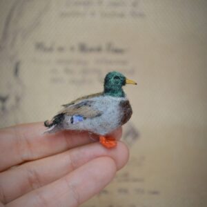 Handmade needle felted male mallard duck miniature inspired by Anas platyrhynchos. Soft wool bird figurine with detailed handcrafted shaping.